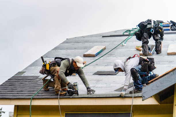 Professional Storm Damage Roof Repair technician working in Lisbon, ME